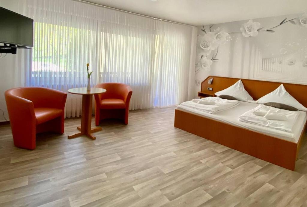 Postel nebo postele na pokoji v ubytování Hotel Krone Riesling