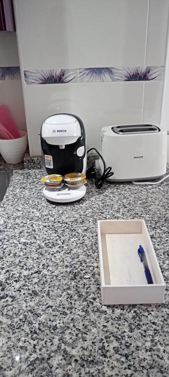 a kitchen counter with a toaster and a toaster at Aparthotel Minerva in Benalmádena