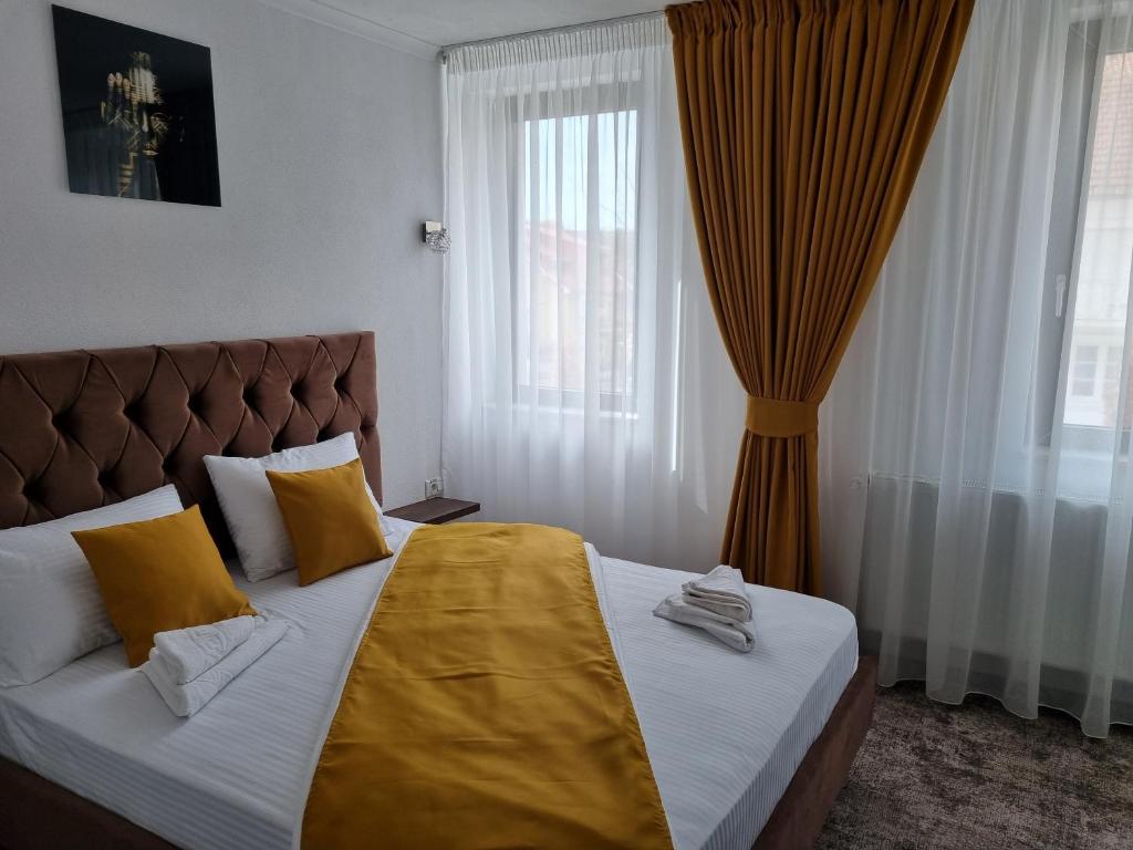 Postel nebo postele na pokoji v ubytování Vila Bun