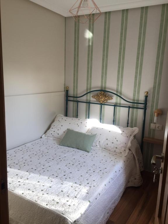 A bed or beds in a room at La casita "A de Naval"