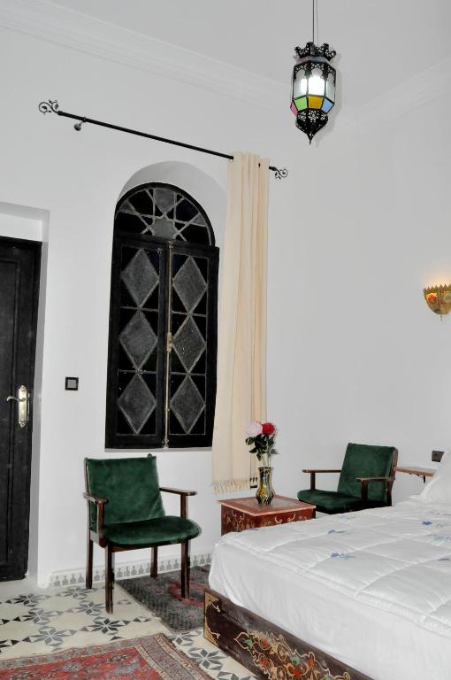 Postel nebo postele na pokoji v ubytování Riad Tingis