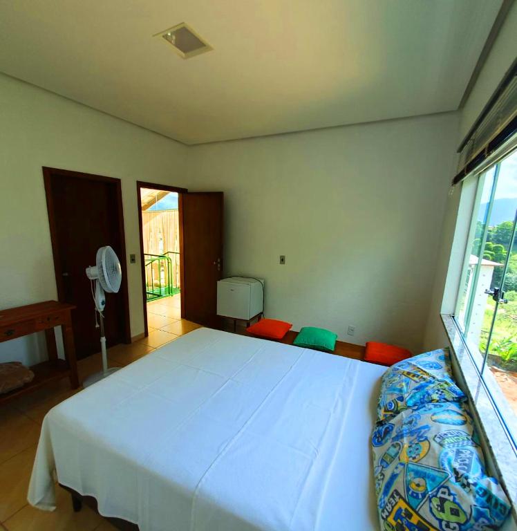 Postel nebo postele na pokoji v ubytování Casa Pedra da Canastra