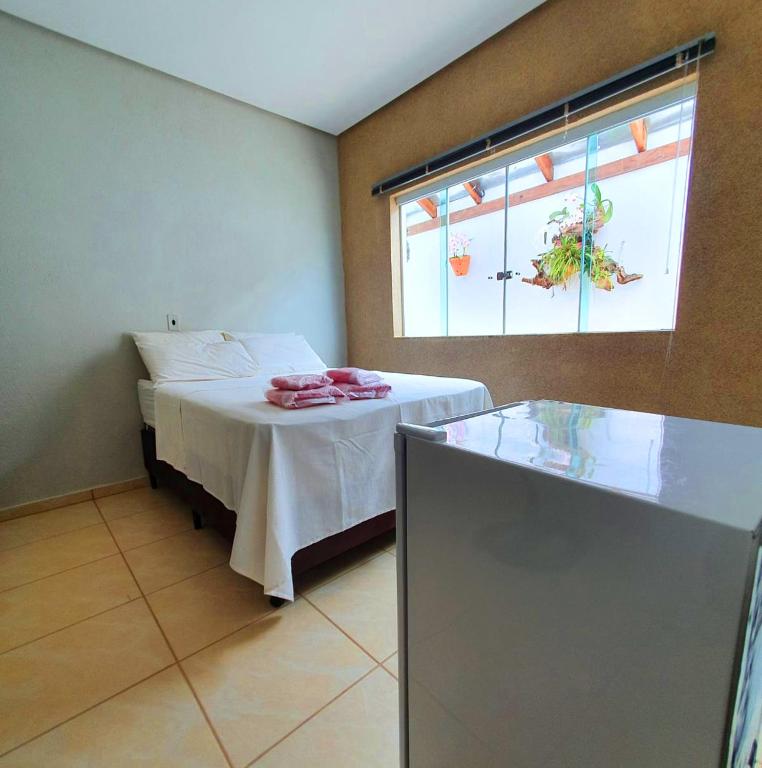 Postel nebo postele na pokoji v ubytování Casa Pedra da Canastra