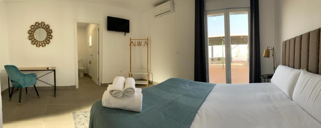 Postel nebo postele na pokoji v ubytování Villamarta Boutique Rooms