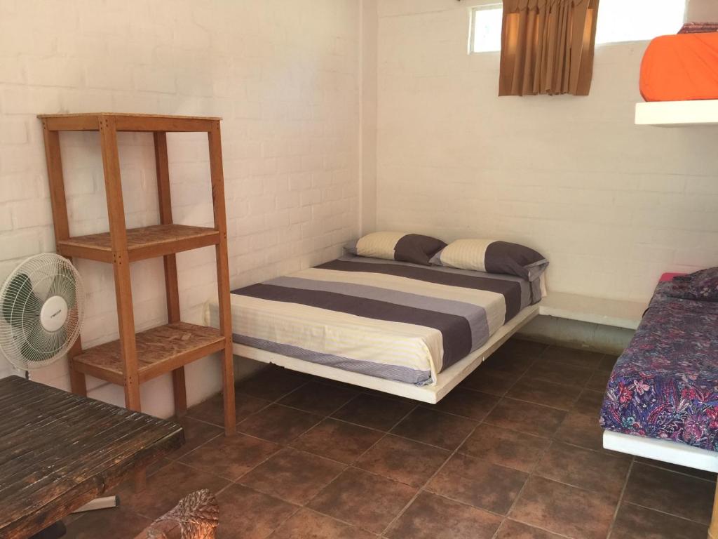 Postel nebo postele na pokoji v ubytování Casa Máncora Guesthouse
