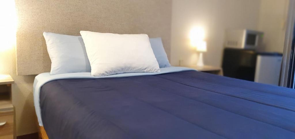 Postel nebo postele na pokoji v ubytování Hospedaje GGG