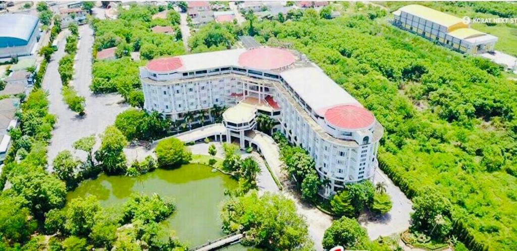 an overhead view of a building with a pond at Hermitage Hotel Korat-SHA in Nakhon Ratchasima