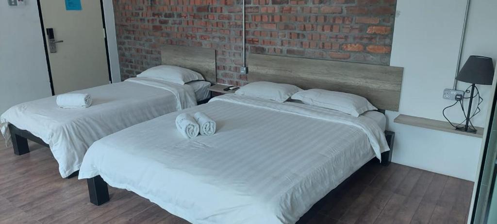 Postel nebo postele na pokoji v ubytování Hotel Nelayan