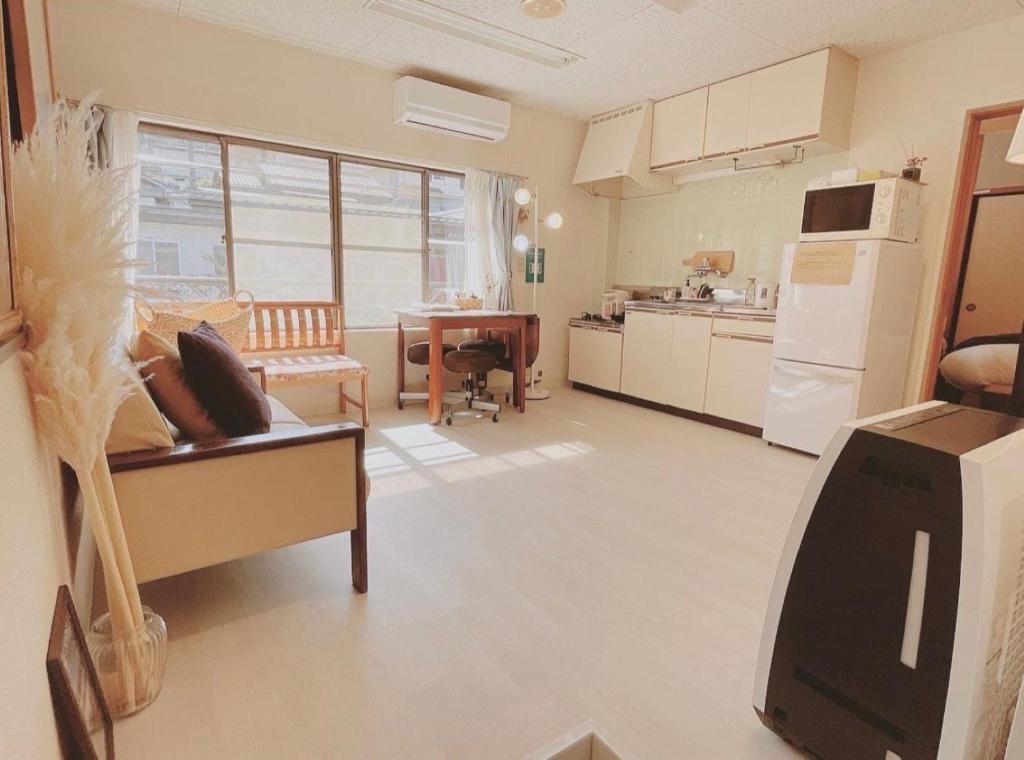 a kitchen and a living room with a tv in it at Minpaku inn Ise-Shima - Vacation STAY 39102v in Ise