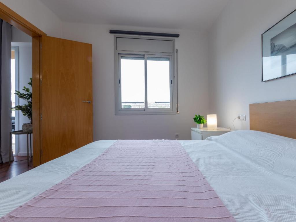 A bed or beds in a room at Apartment Terecel Salou-14 by Interhome