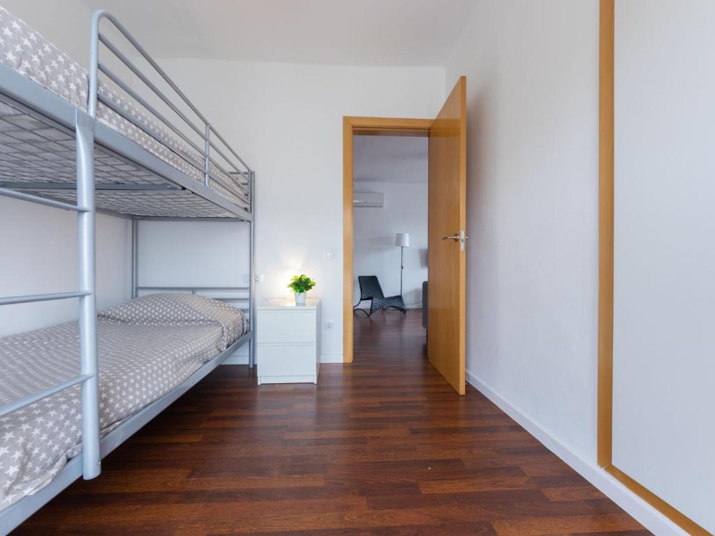 A bed or beds in a room at Apartment Terecel Salou-14 by Interhome