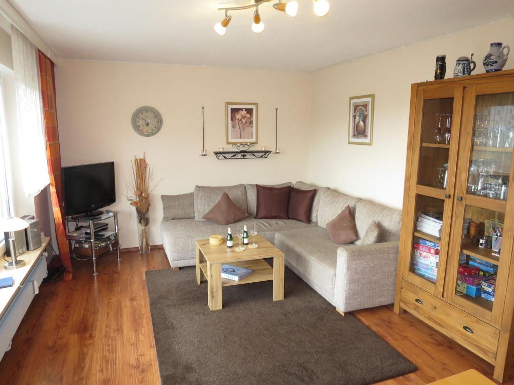 a living room with a couch and a coffee table at Apartment Panorama by Interhome in Berghofen