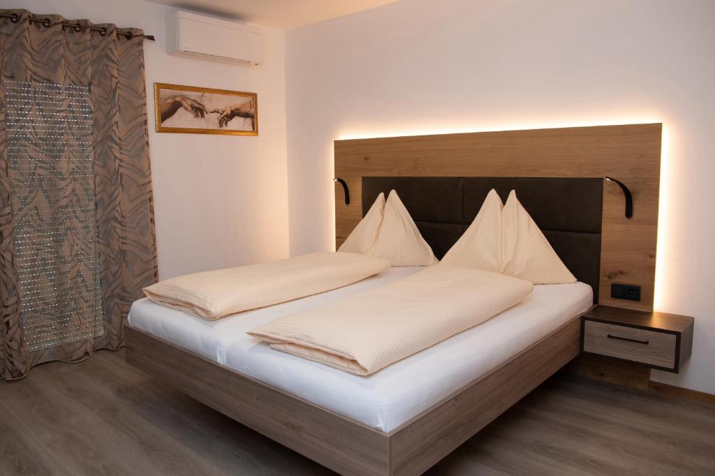 Postel nebo postele na pokoji v ubytování Hotel Restaurant Ulbing