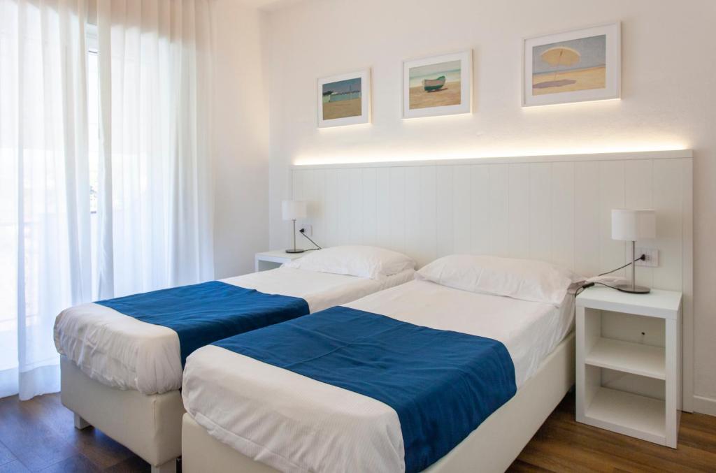 Postel nebo postele na pokoji v ubytování Hotel Tarabella