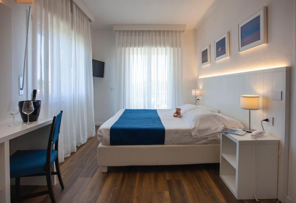 Postel nebo postele na pokoji v ubytování Hotel Tarabella
