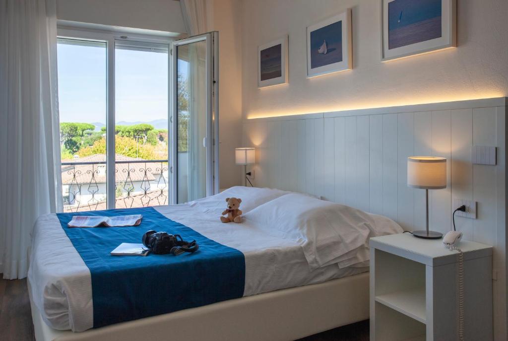 Postel nebo postele na pokoji v ubytování Hotel Tarabella
