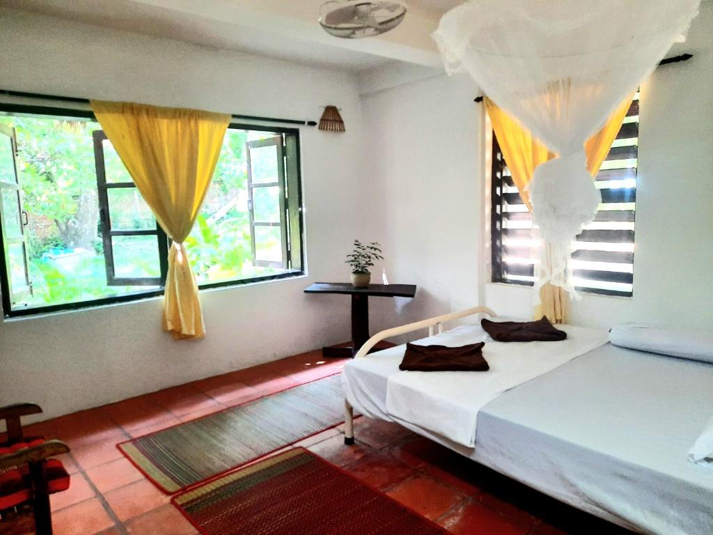 Postel nebo postele na pokoji v ubytování Jungle House Kep