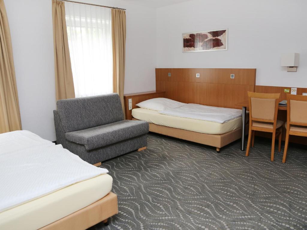 Postel nebo postele na pokoji v ubytování Hotel Lindleinsmühle