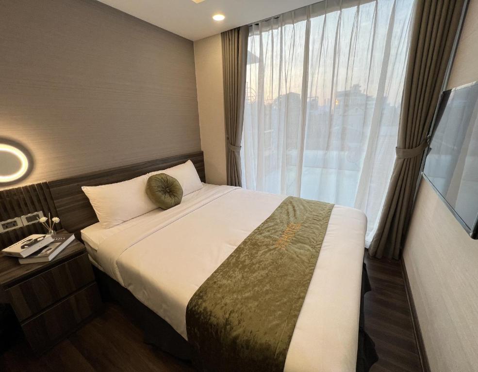 Postel nebo postele na pokoji v ubytování 3T Hotel Hanoi