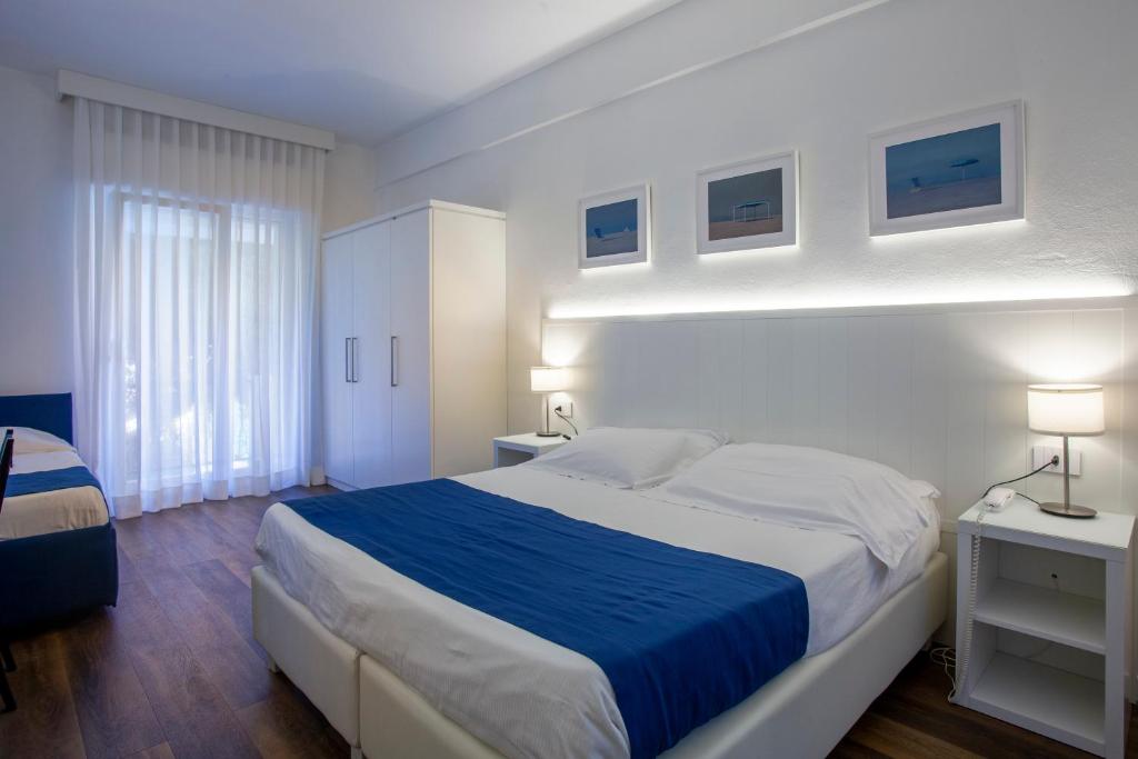 Postel nebo postele na pokoji v ubytování Hotel Tarabella