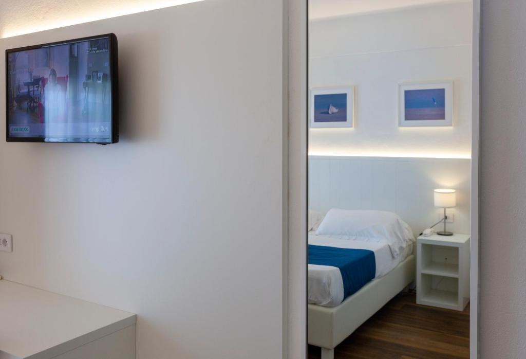 Postel nebo postele na pokoji v ubytování Hotel Tarabella