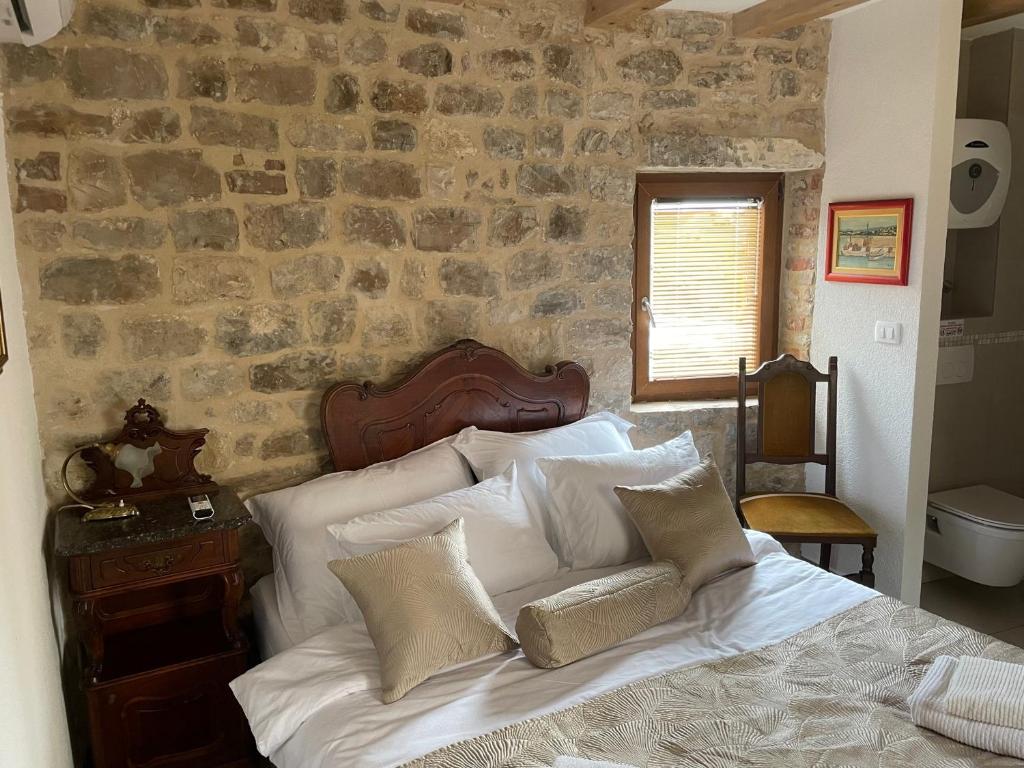Postel nebo postele na pokoji v ubytování Castle Inn