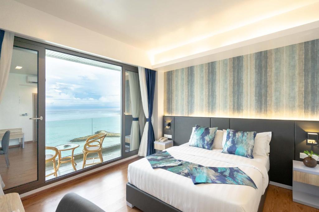 Postel nebo postele na pokoji v ubytování Arena Beach Hotel