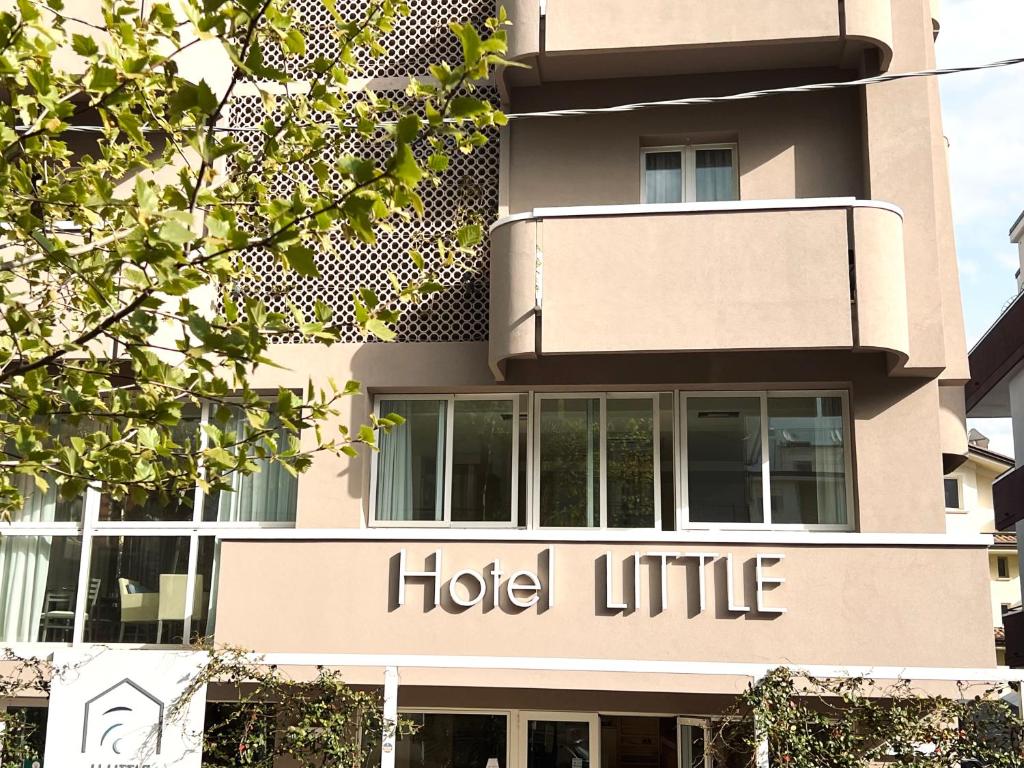 a building with a hotel life sign on it at Hotel Little in Rimini