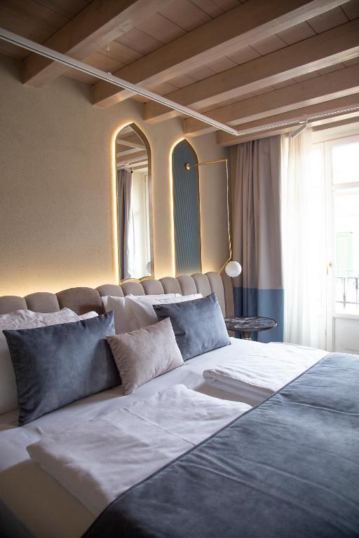 Postel nebo postele na pokoji v ubytování Relais Balcone di Giulietta