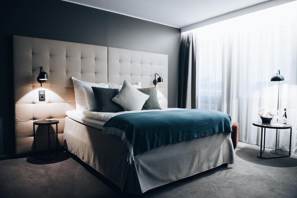 Postel nebo postele na pokoji v ubytování Clarion Hotel Gillet