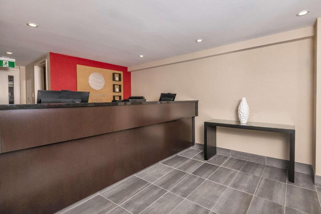 a waiting room at a hospital with a reception desk at Comfort Inn in Ottawa