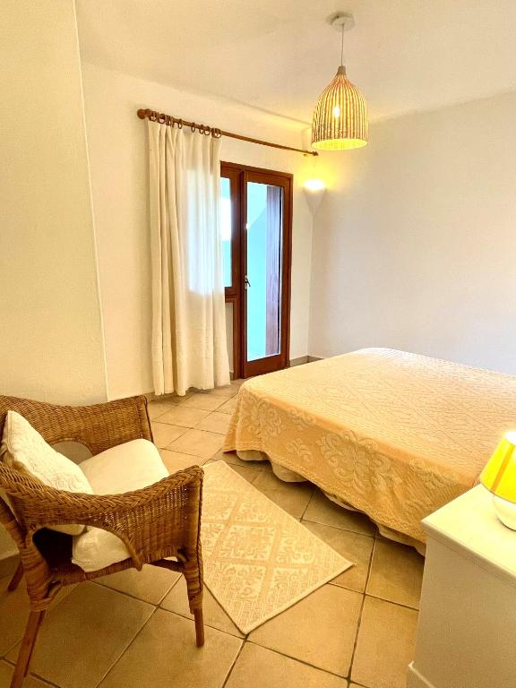 A bed or beds in a room at La Casa Smeralda