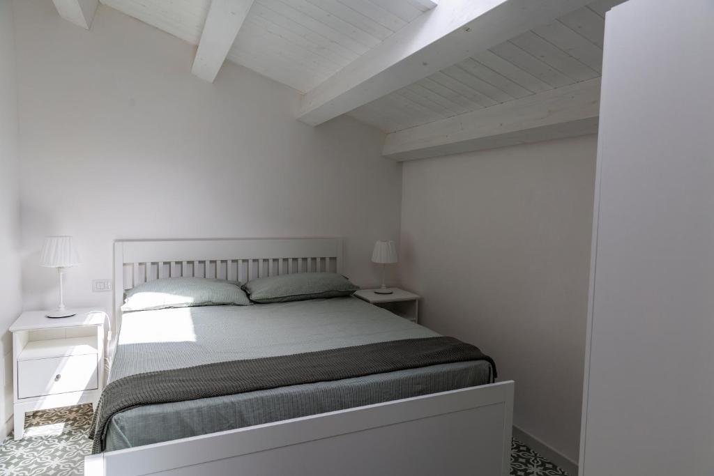 A bed or beds in a room at Casa Gioconda