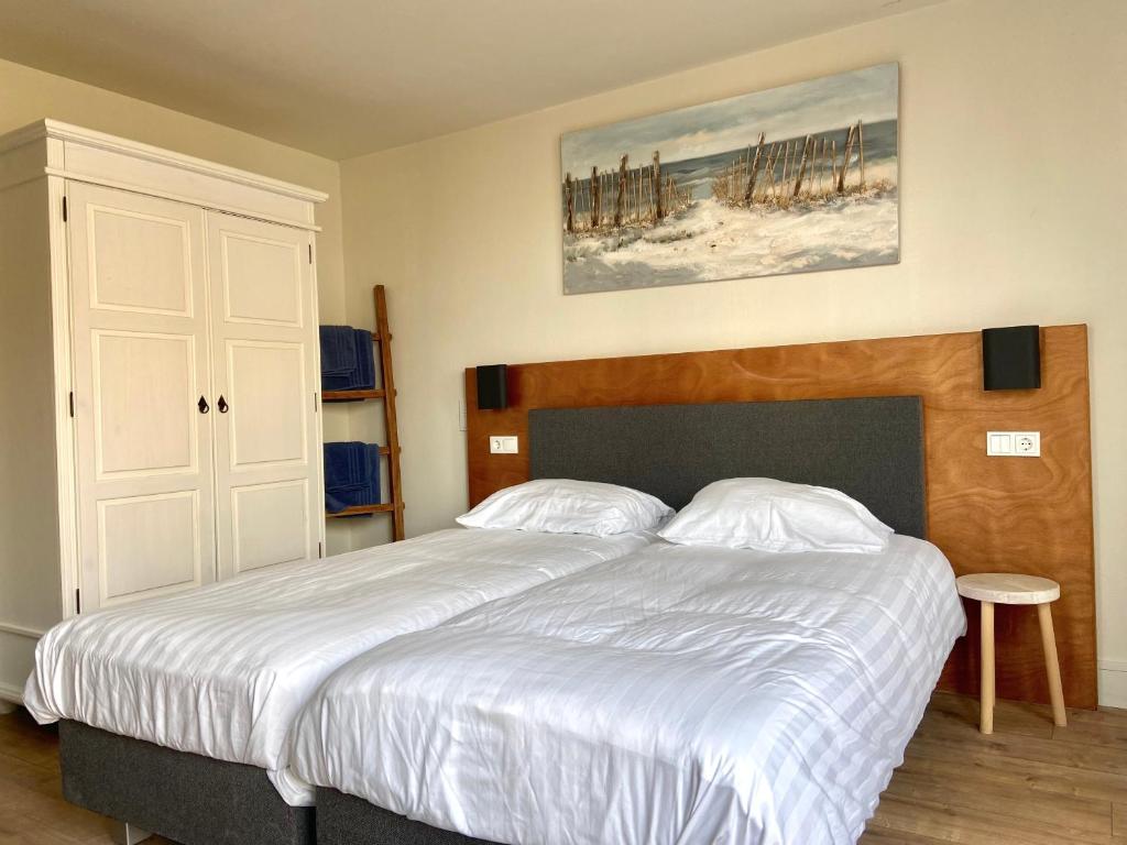 Postel nebo postele na pokoji v ubytování Bed & Ontbijt Haddock