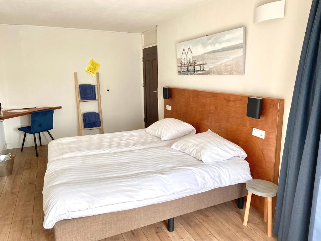 Postel nebo postele na pokoji v ubytování Bed & Ontbijt Haddock