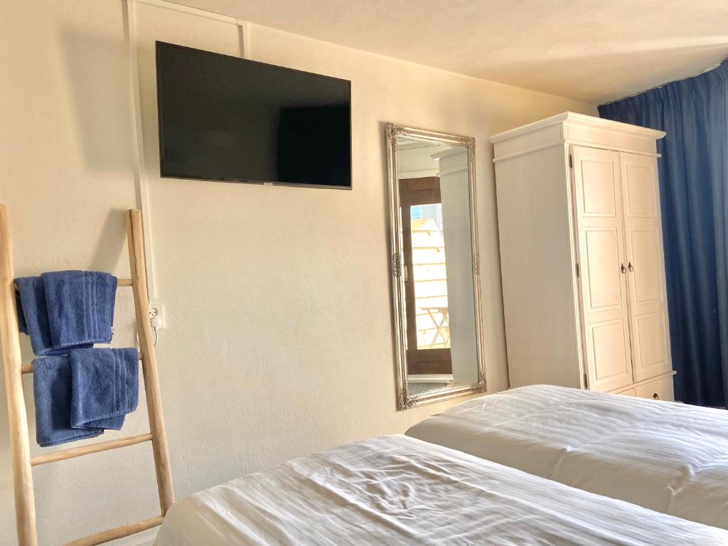 Postel nebo postele na pokoji v ubytování Bed & Ontbijt Haddock