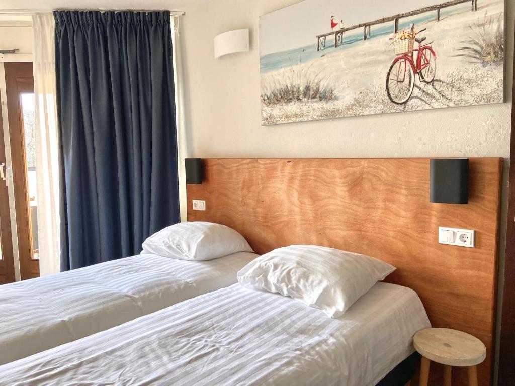 Postel nebo postele na pokoji v ubytování Bed & Ontbijt Haddock