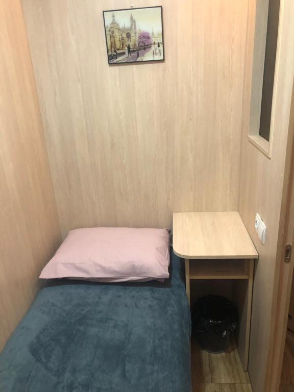 Postel nebo postele na pokoji v ubytování CapsulePlus