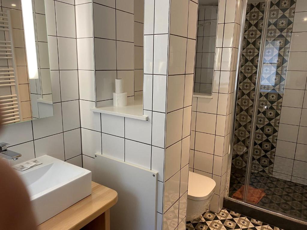 Koupelna v ubytování Hotel Au Cerf