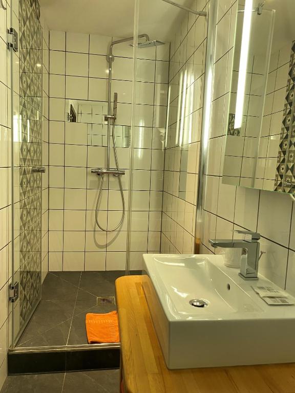 Koupelna v ubytování Hotel Au Cerf