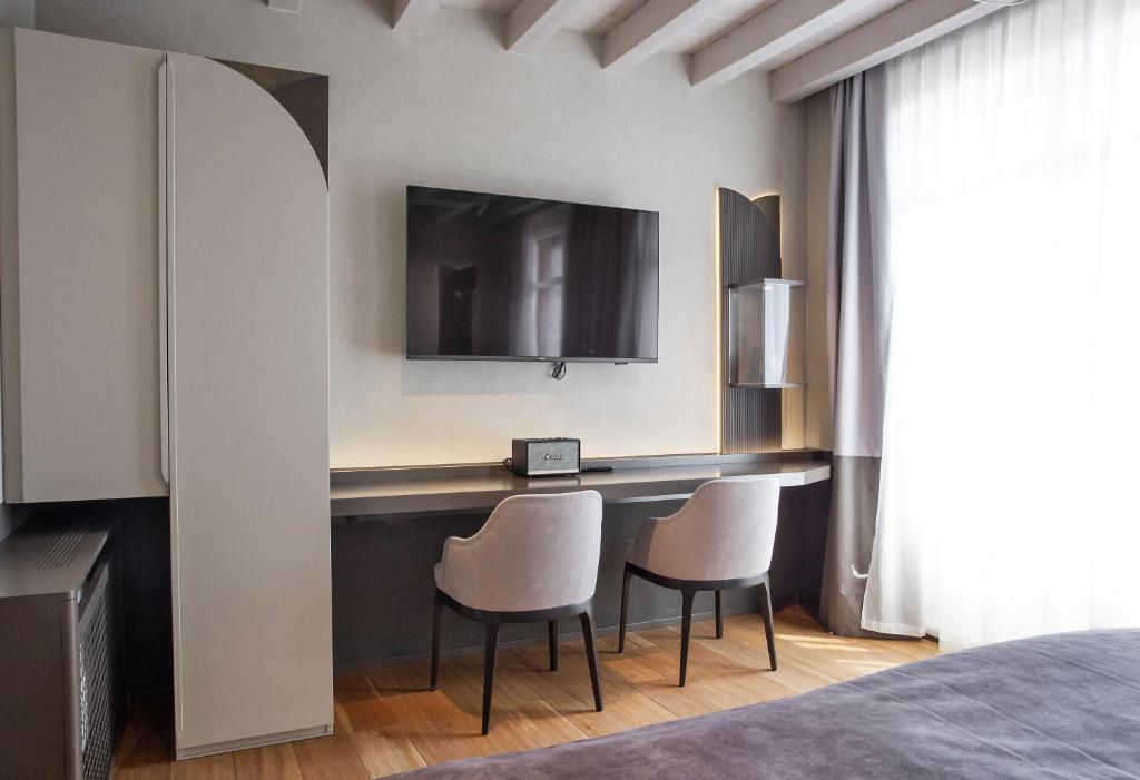 TV a/nebo společenská místnost v ubytování Relais Balcone di Giulietta