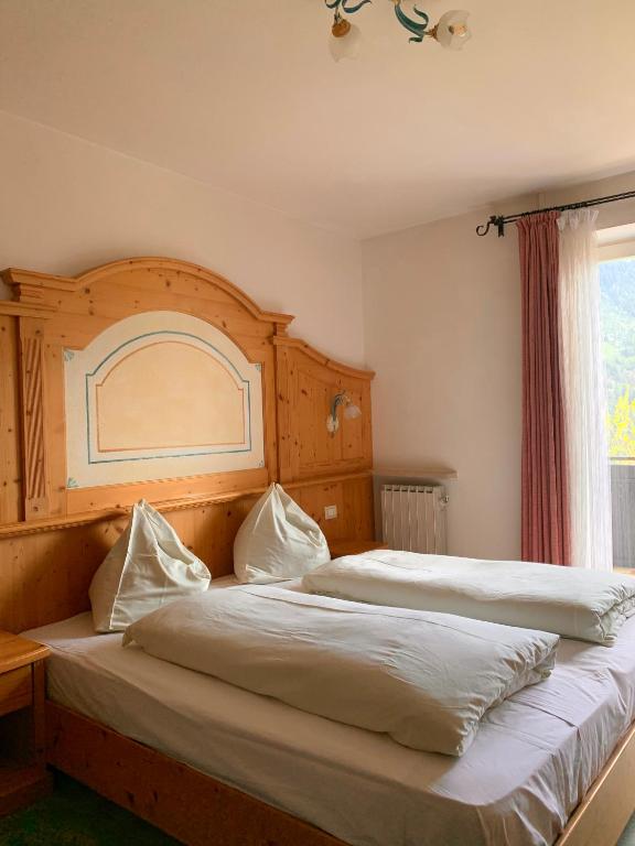Postel nebo postele na pokoji v ubytování Garni Rika