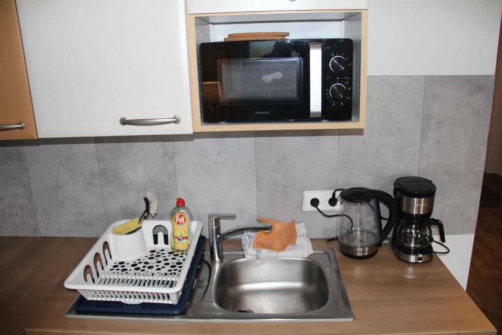Kuchyň nebo kuchyňský kout v ubytování Workers Appartements Kreuzwirt