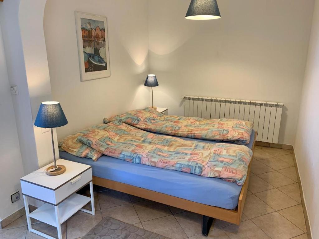 Postel nebo postele na pokoji v ubytování Appartamento di vacanza tra i vigneti