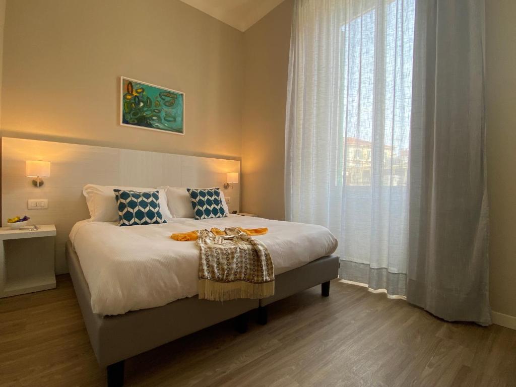 Postel nebo postele na pokoji v ubytování Hotel Eletto
