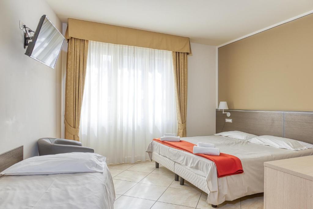 Postel nebo postele na pokoji v ubytování Hotel Lumin