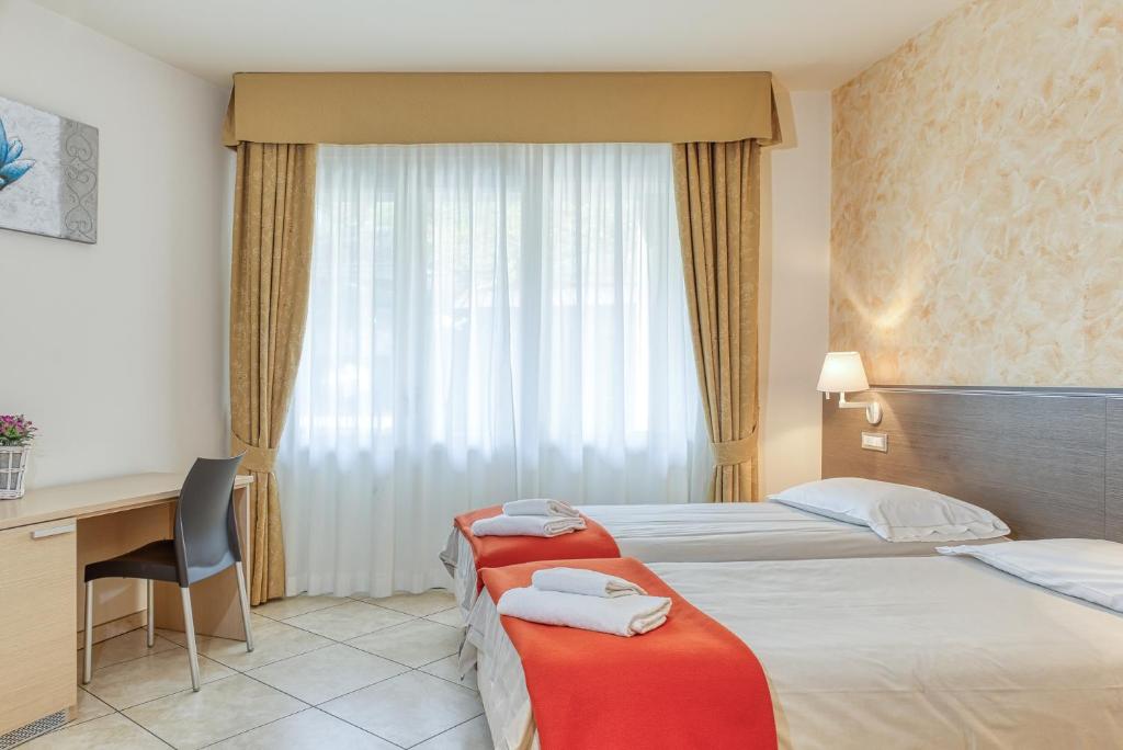 Postel nebo postele na pokoji v ubytování Hotel Lumin