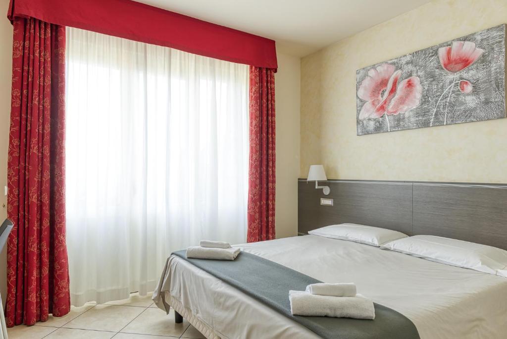 Postel nebo postele na pokoji v ubytování Hotel Lumin