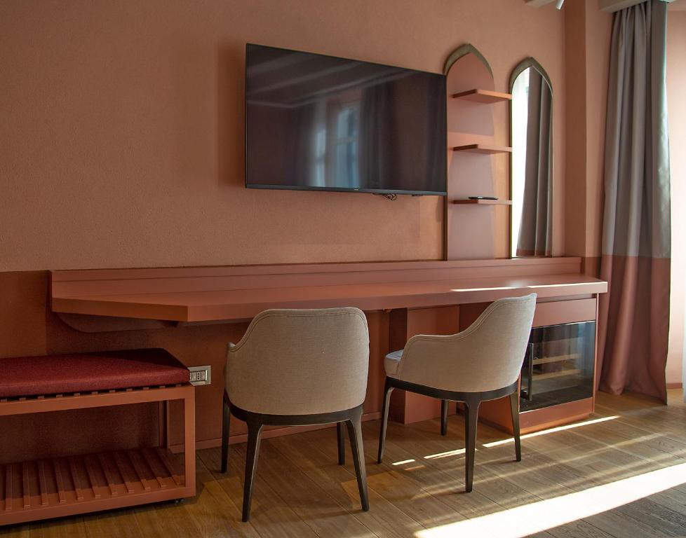 TV a/nebo společenská místnost v ubytování Relais Balcone di Giulietta