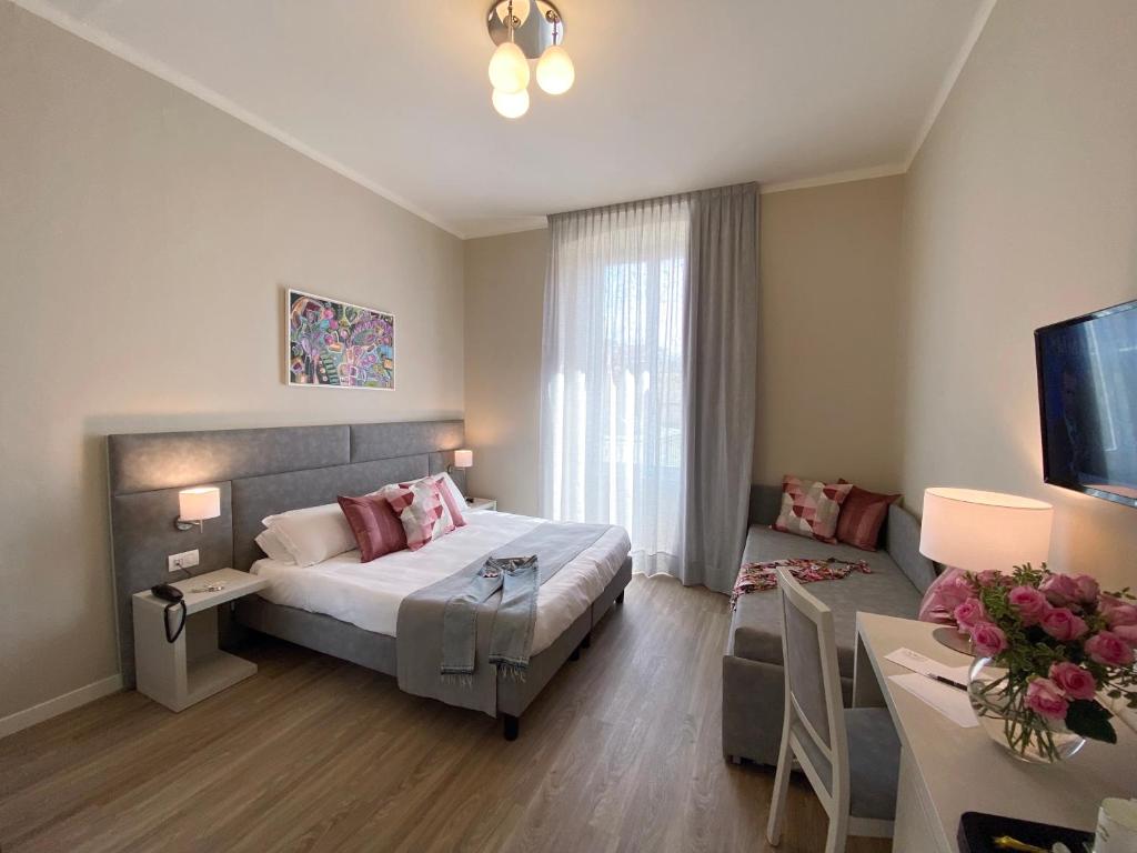 Postel nebo postele na pokoji v ubytování Hotel Eletto